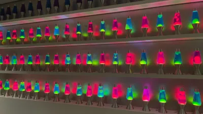 Several rows of different colour lava lamps in the Cloudflare offices